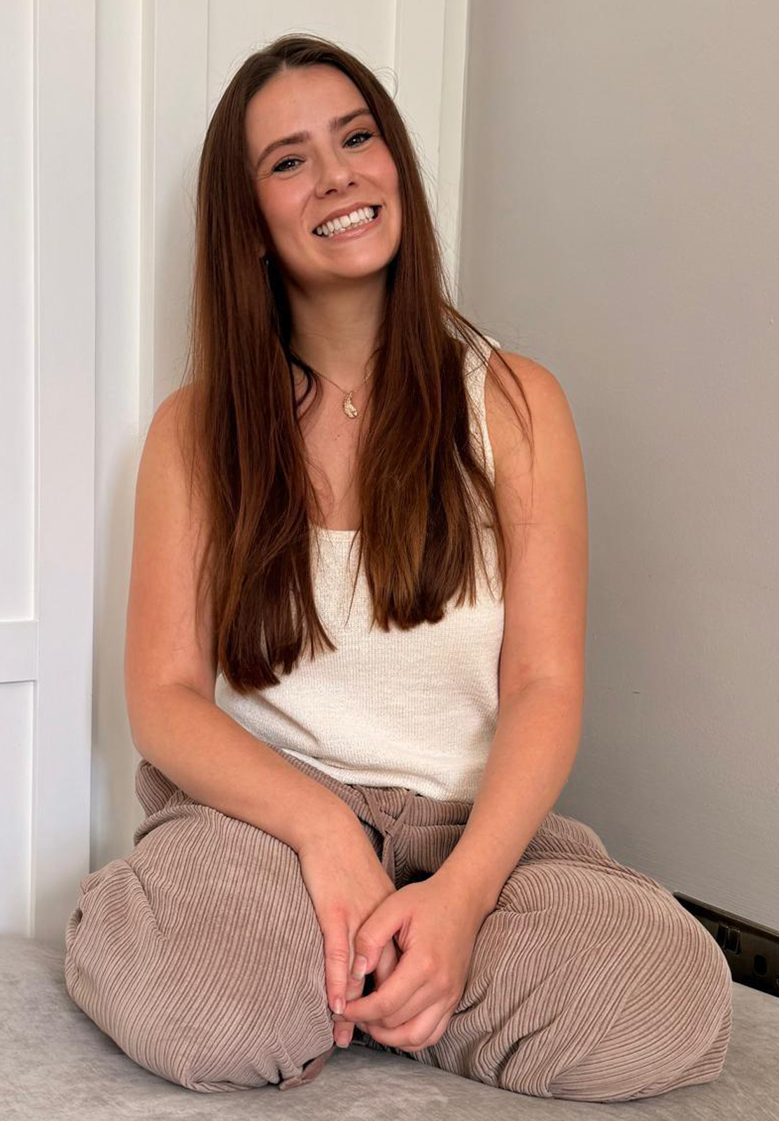 Lauren wearing a white top